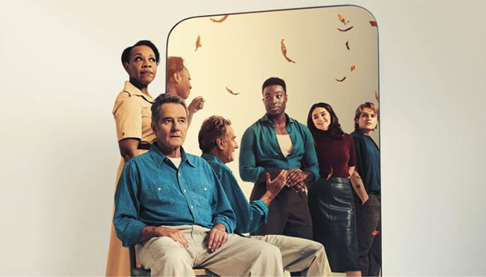 A group of six people stand or sit in front of a mirror with expressions ranging from contemplative to hopeful, positioned against a backdrop of falling autumn leaves.