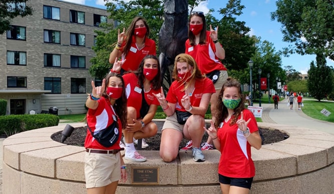 Group photo in front of the Fairfield campus stag statue