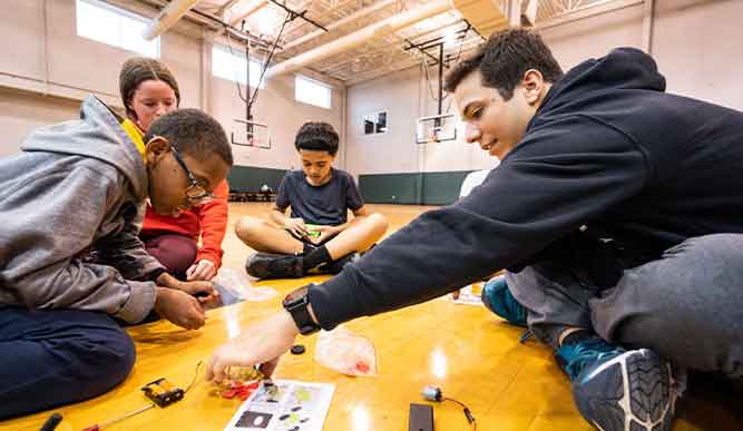 Fairfield students helping younger students at Wakeman Boys and Girls club.