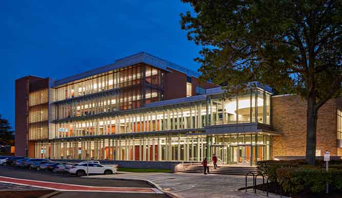 Exterior of the Egan School at night.