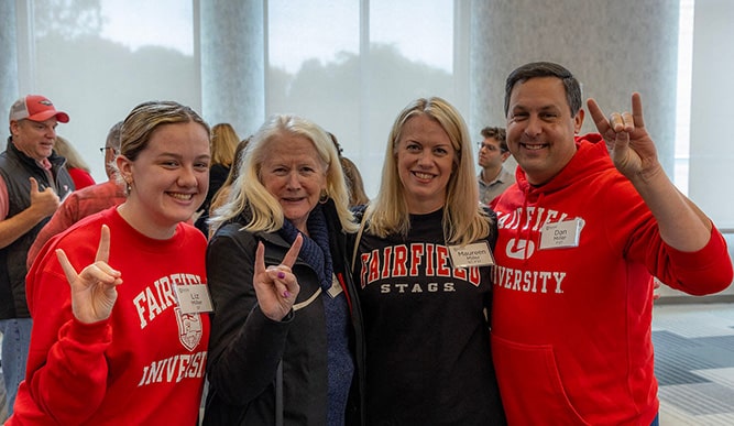 Three generations of Stags attending a legacy association brunch event to mingle with other legacy association members.