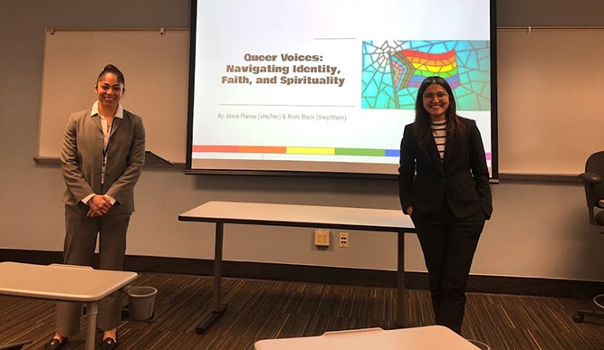 Fairfield students smiling in a conference room, ready for their 'Queer Voices' presentation at the Ignatian Q conference.