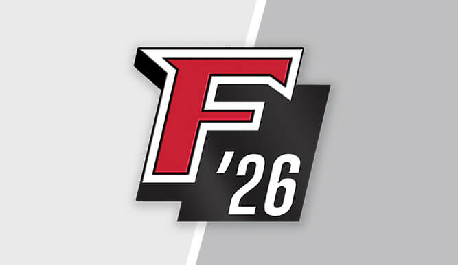 A commemorative pin that displays the Fairfield "F" and the number 26 side by side. 