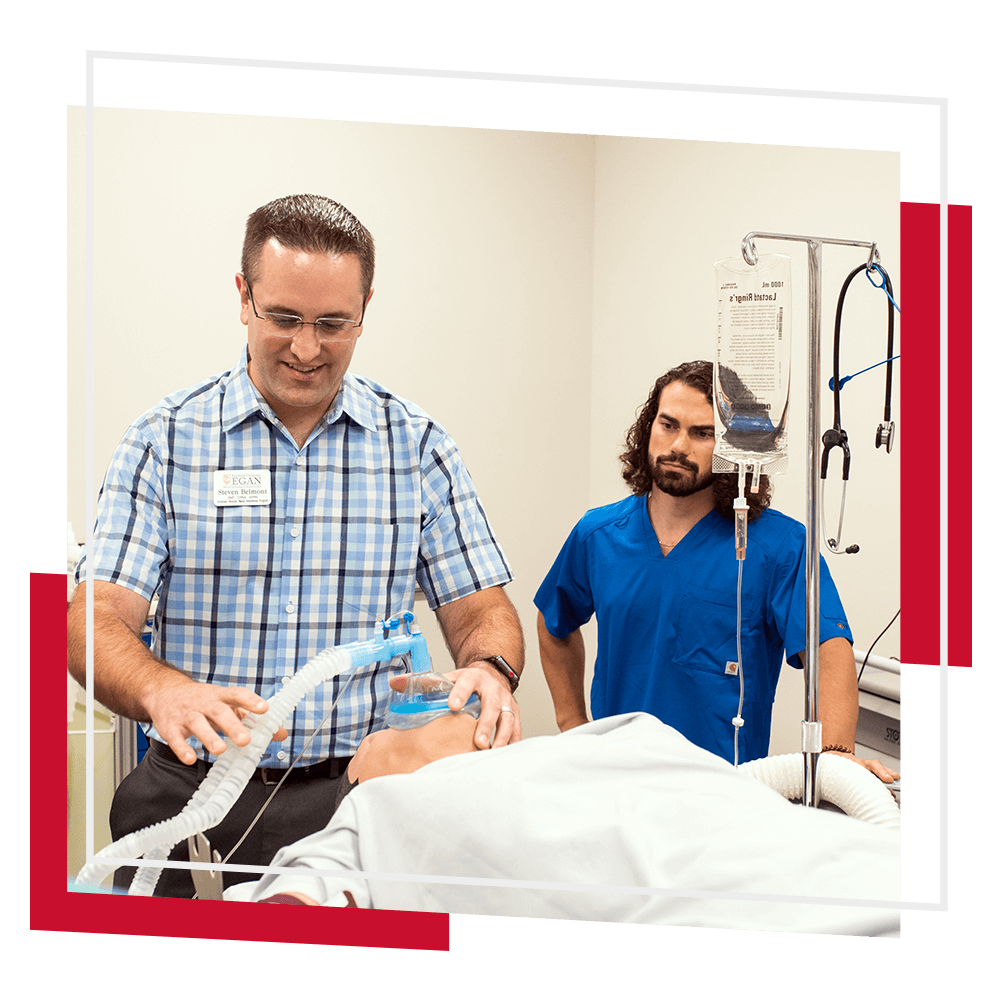 Professor and student in lab training in a hospital setting.