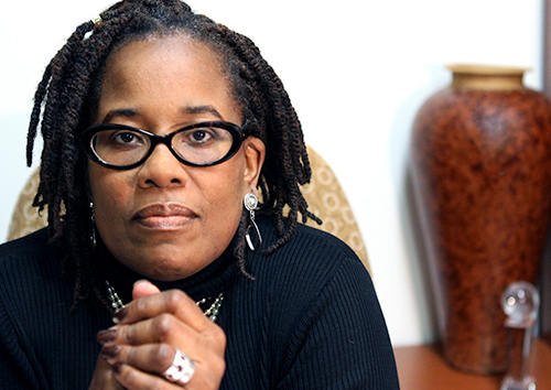 Karsonya Wise Whitehead headshot with vase in background.