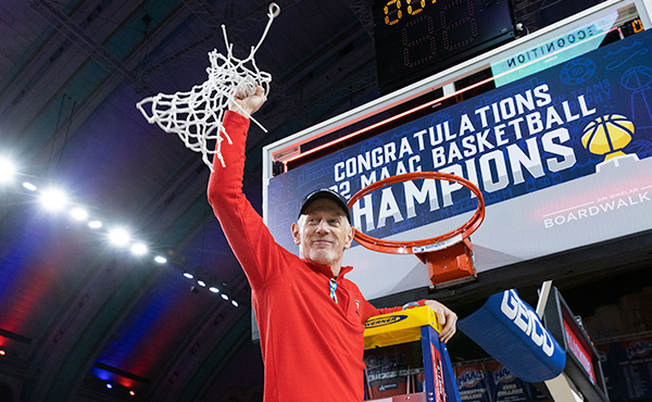 Coach Joe Frager cuts down the net following the Stags’ MAAC Championship win.