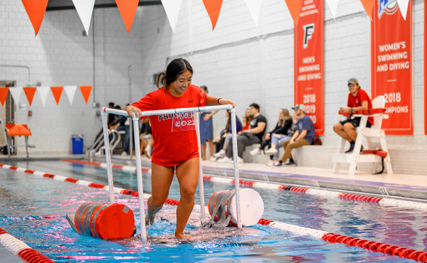 Kayleigh Chin ’26 pilots her team’s contraption in the “Walk on Water” competition.