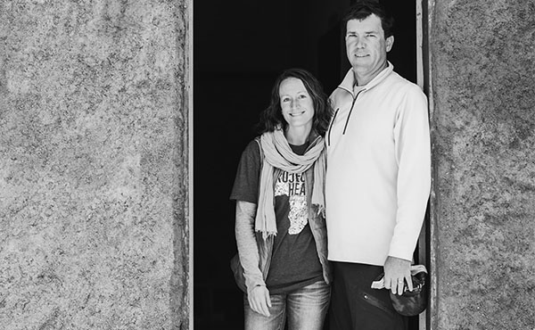Colleen (Cunningham) and Dan Taylor ’01 standing in the doorway of their Love for the Children Academy in Chacha, Ethiopia.