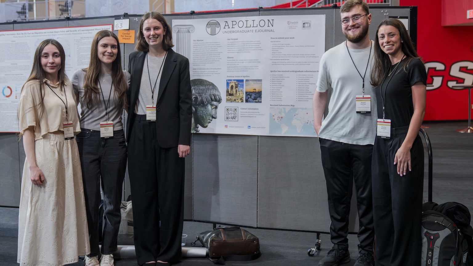 Students at the research symposium standing in front of their poster. 