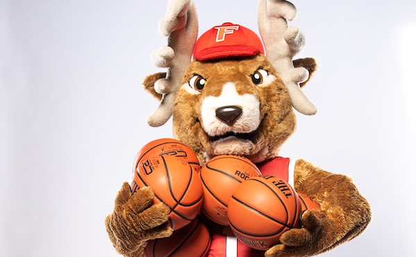Lucas the Stag with an armful of basketballs.