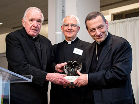 Fr. Bowler and Fr. Blaszczak present Bishop Caggiano with 2019 Bowler Award