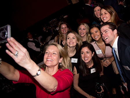 Young Alumni take a celebratory selfie at last year's Awards Dinner.