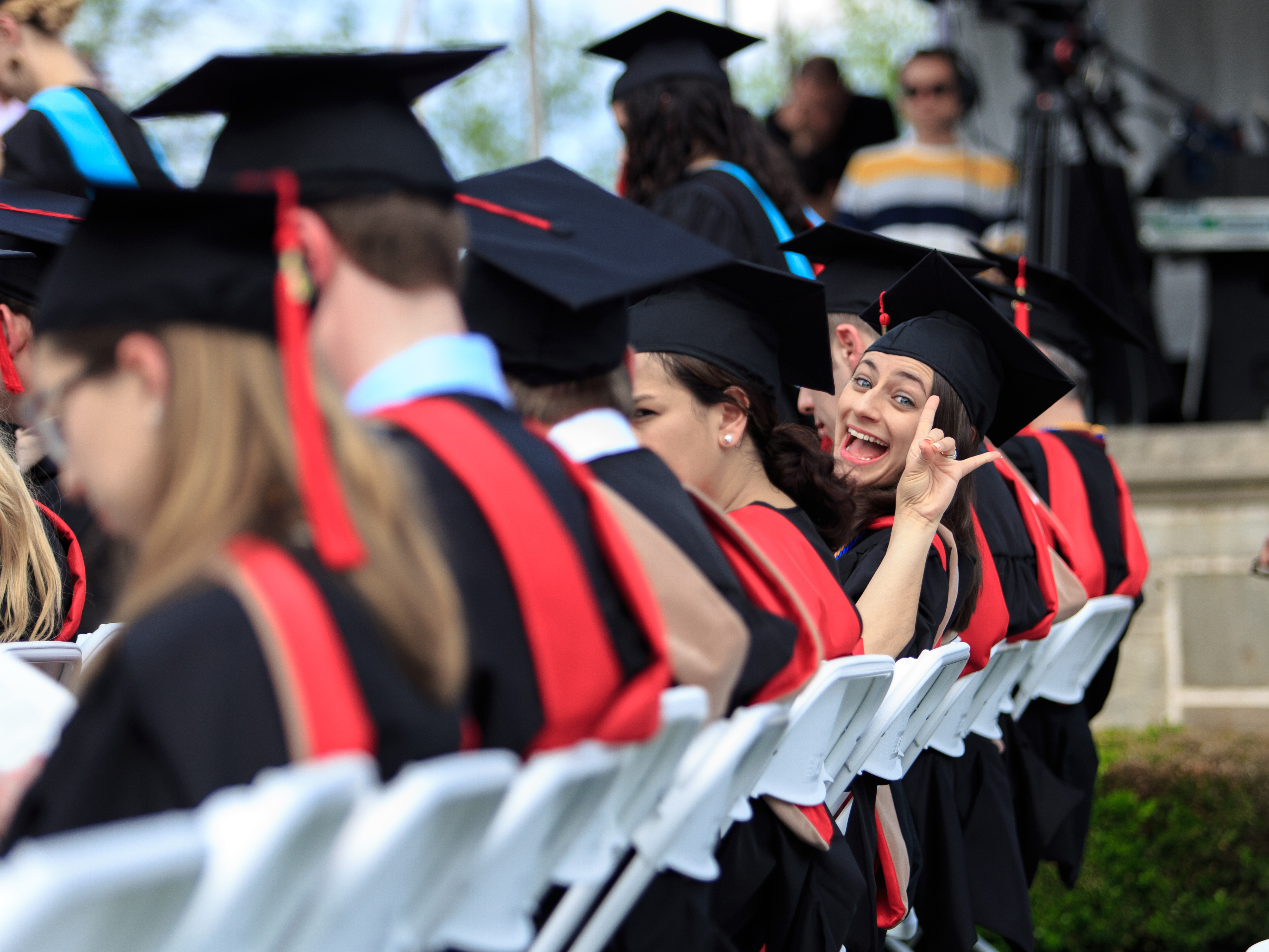 A Fairfield University graduate celebrates during a Commencement ceremony.