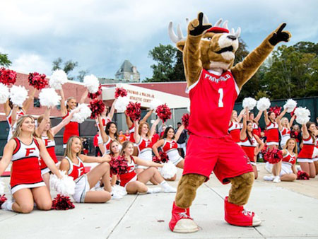 Fairfield University's Lucas the Stag and Cheerleading team leading a cheer. 