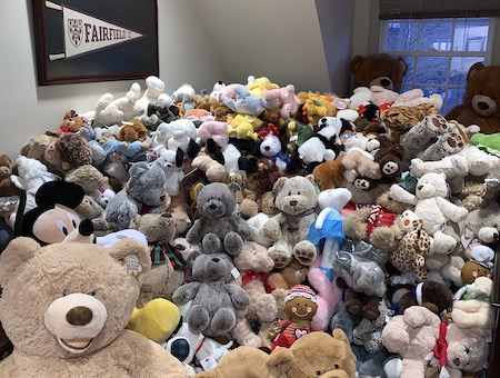 a pile of teddy bears await distribution