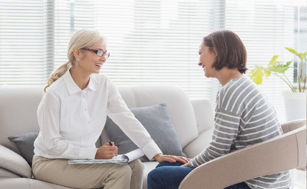 Stock photo of social worker and client