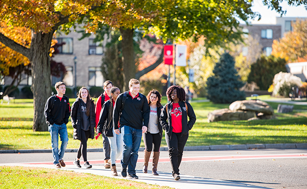 Fairfield students walking on campus in autumn.