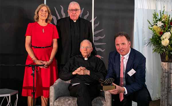 Janet Canepa, Fr. Bowler, Fr Allen, And Pete Harding at the award presentation on Sept. 19.