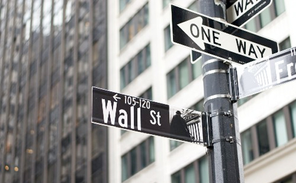 Photo of Wall Street and One Way street signs.