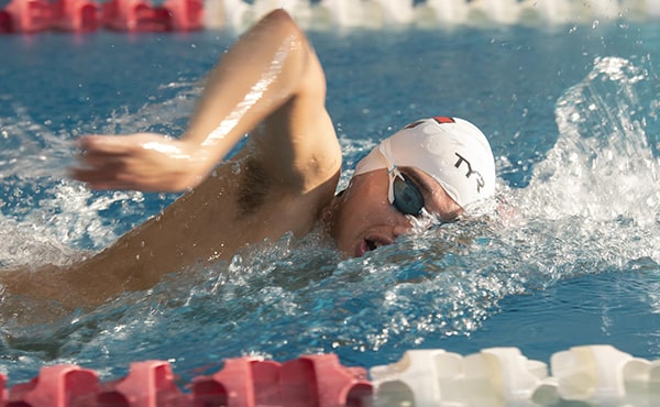 Action shot of paralympic student-athlete swimming the 1500m freestyle in the Paralympics National Championships.