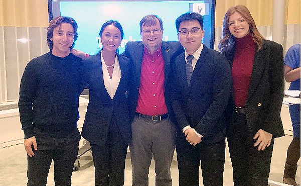 Photo of students at the 2022 Connecticut Pitchoff Event (l-r): Shahnt Madalian ’23, Celine King ’23, StartUp Program Director Chris Huntley, PhD, Wilson Alexi ’21, MSBA’23, and Mariana Antaya ’23.