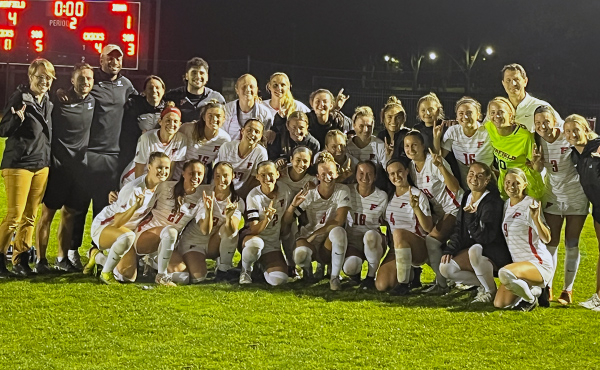 Women's soccer team group shot after a 4-1 win over Iona.