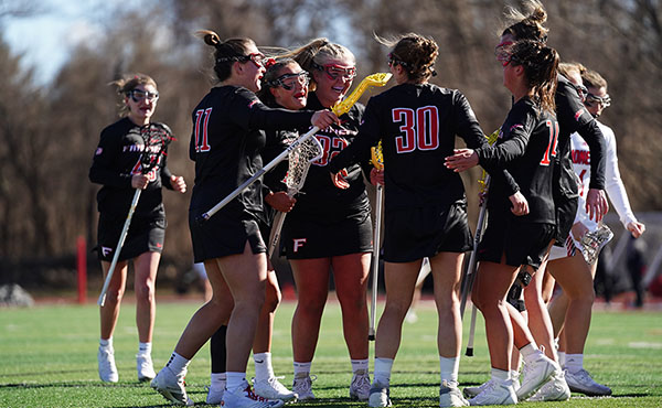Fairfield Women's Lacrosse celebrates a goal in last month's win at Iona