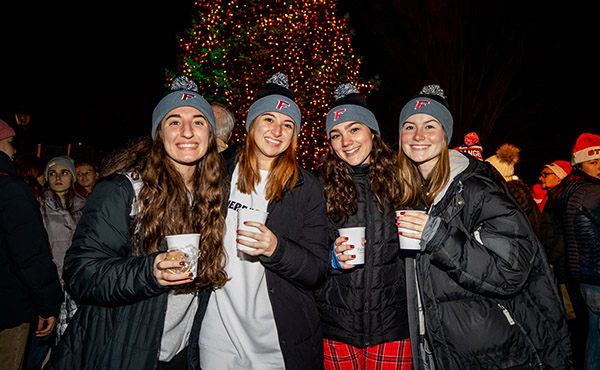 Fairfield University students dressed snugly and enjoying hot chocolate at the annual on-campus Christmas Tree Lighting Ceremony.