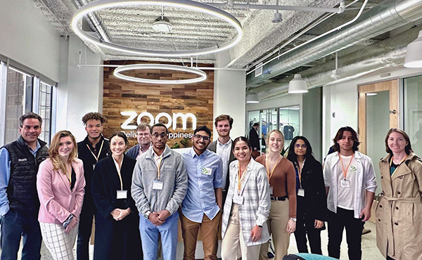 Group photo of students on Silicon Valley immersion trip inside Zoom headquarters.