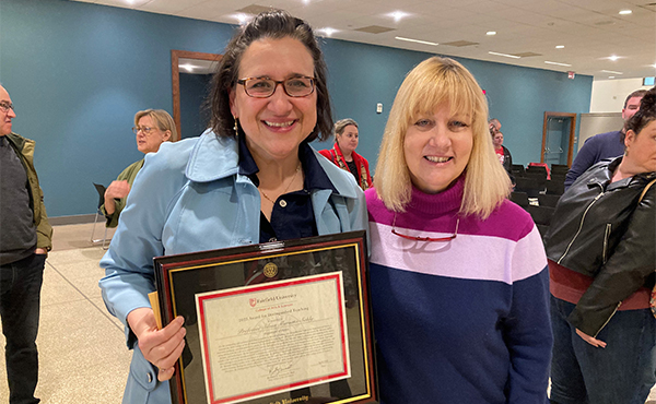 Silvia Marsans-Sakly, PhD, and Patricia Behre, PhD, at the College of Arts and Sciences Faculty and Staff Awards Ceremony.
