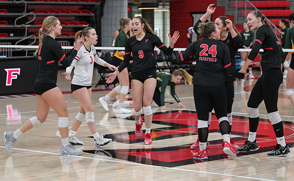 The women's volleyball team celebrate a point in the win over Siena on November 4, 2023.