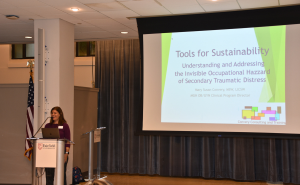 Julie Berrett Abebe, assistant professor of social work, and project director of Fairfield Collaborates for a Healthier Connecticut (FCHC) Scholars program introduces secondary traumatic stress in relation to sustainability within the social work practice. 