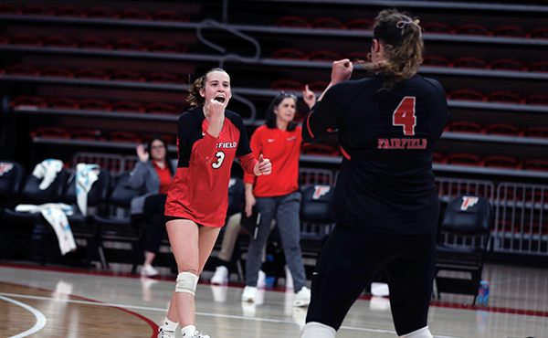 Kyla Berg celebrates a point in Wednesday's win over Iona