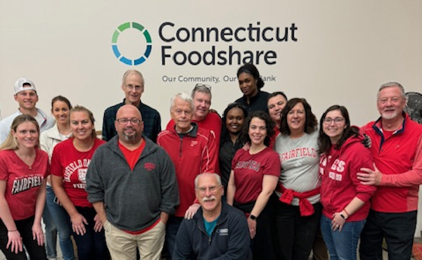 Group photo of Fairfield Staff and Alumni Board members serving at Connecticut Foodshare during Jesuit Service Month. 