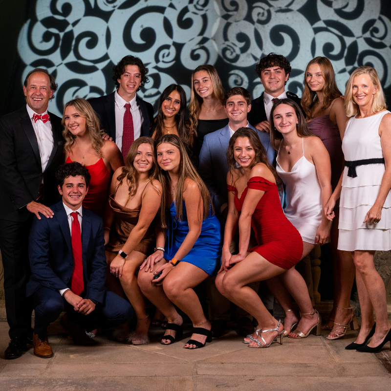 A group of students posing with President Mark R. Nemec and his wife at the annual Pres Ball.