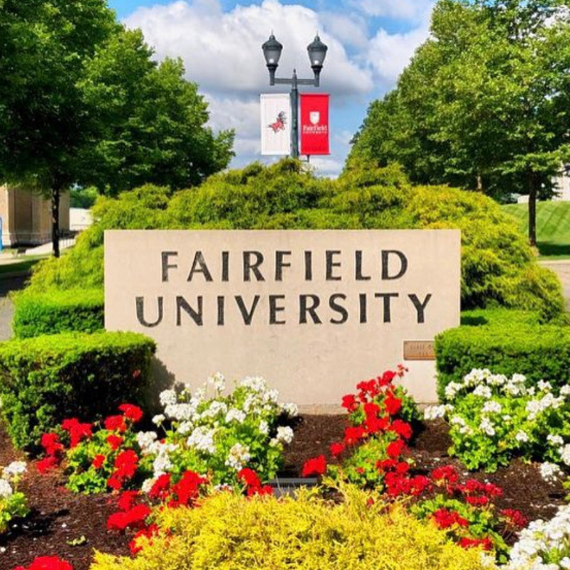 Fairfield University's headline stone signage at the campus entrance.