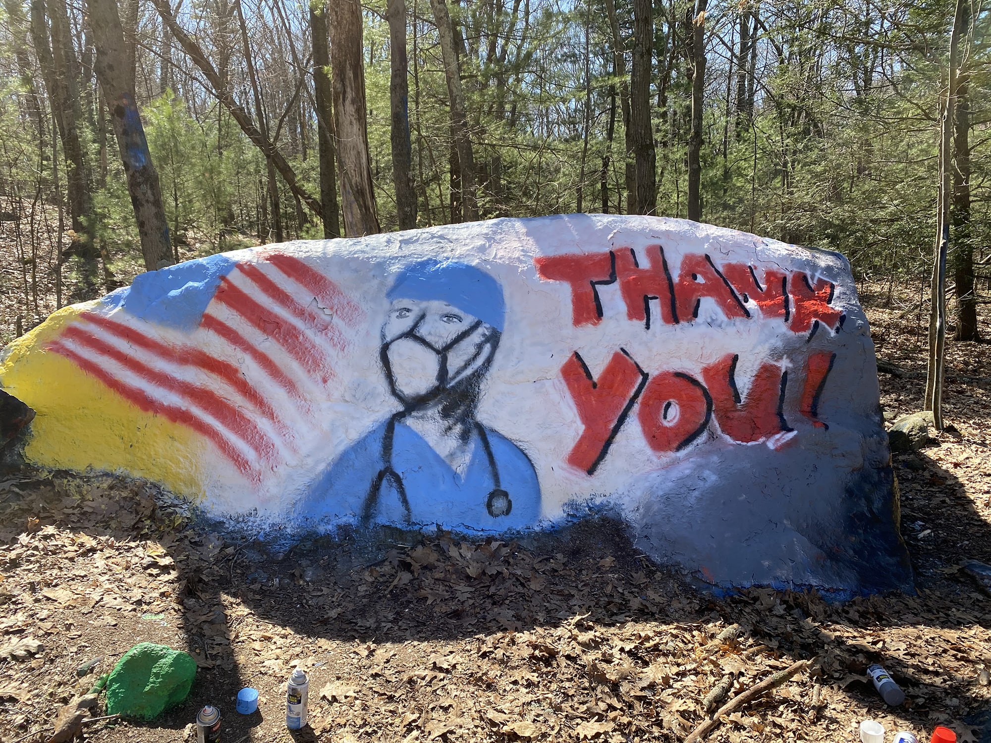 Painting paying tribute to healthcare workers on a rock in Burlington, CT